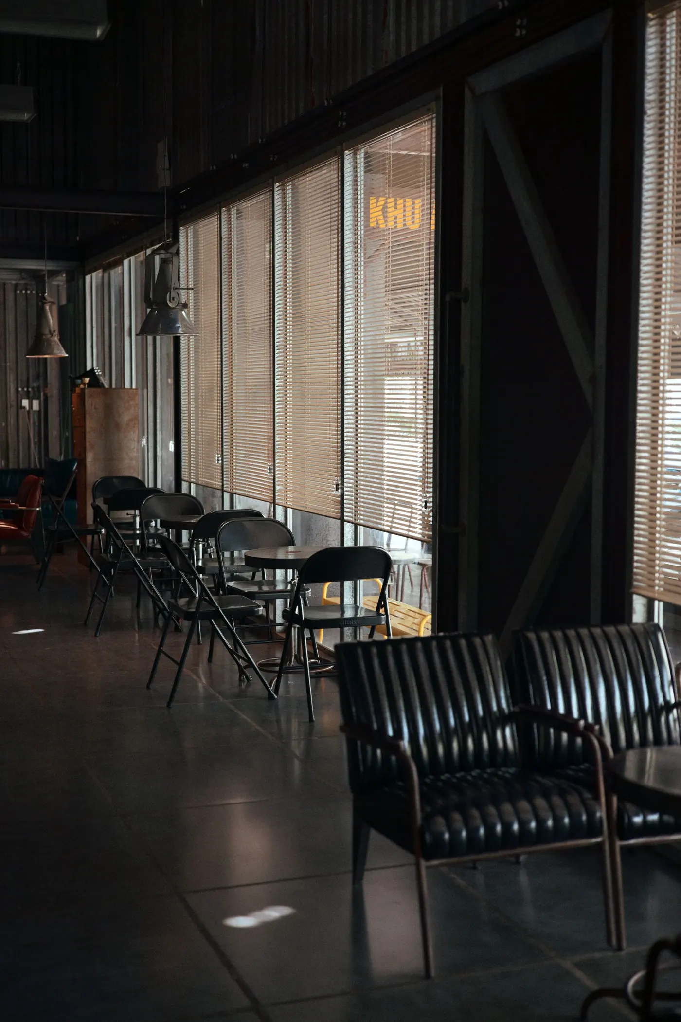 Stock photo: cafe interior with exposed ceiling and empty seating