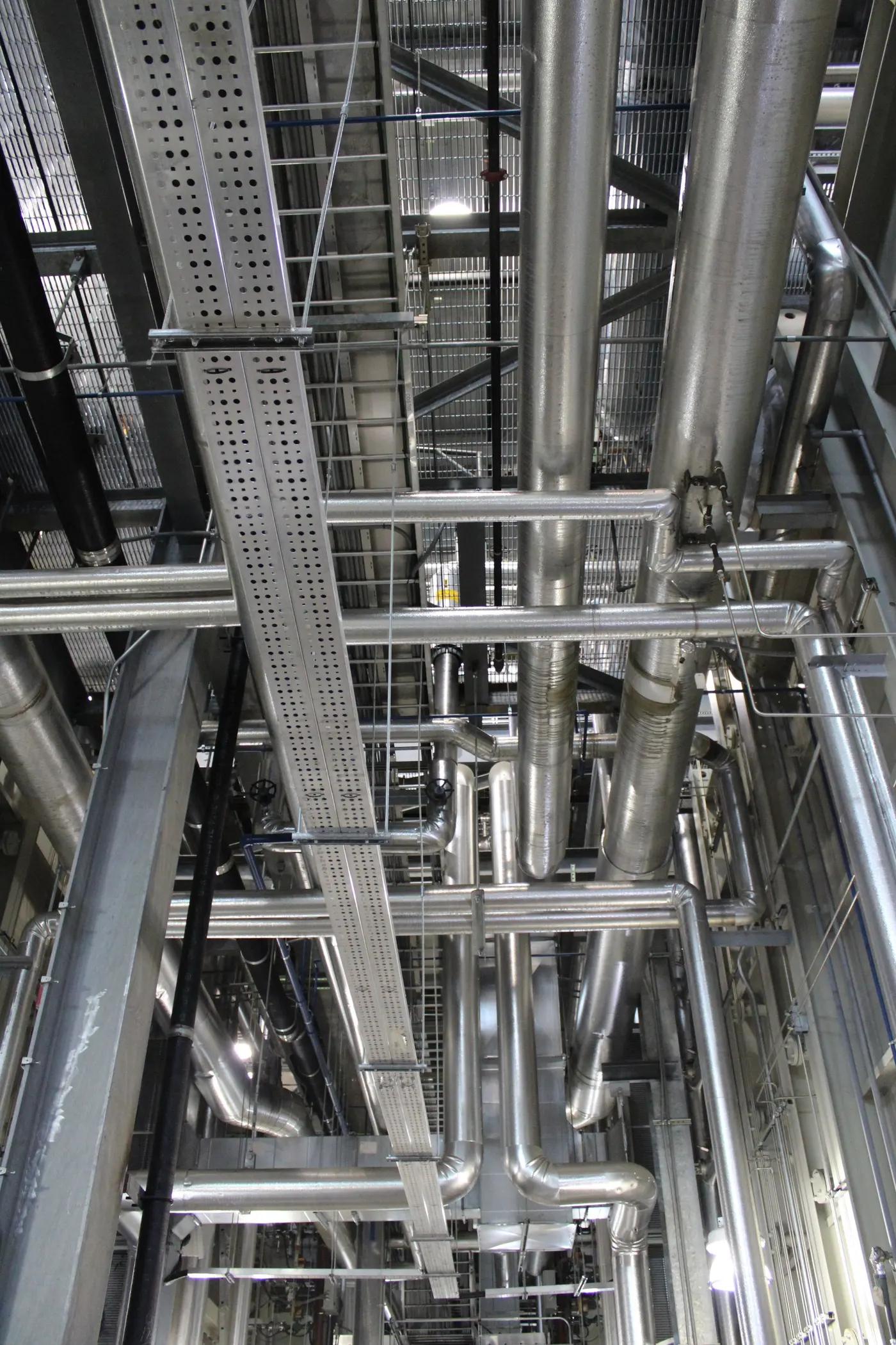 Stock photo: exposed ceiling with cable trays, conduit and piping