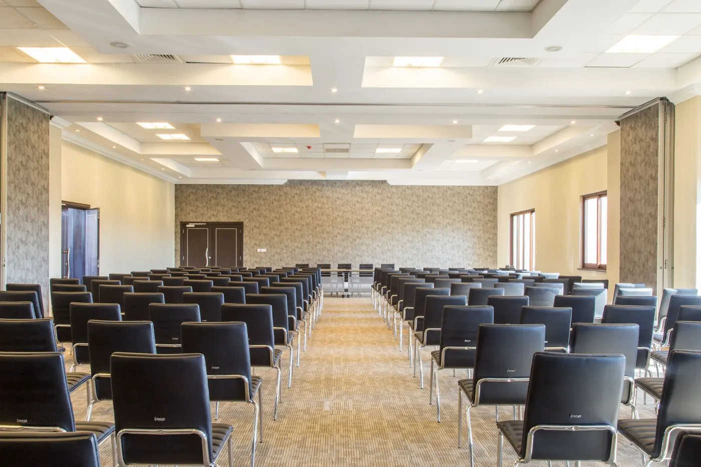 Stock photo: large meeting room with rows of empty chairs