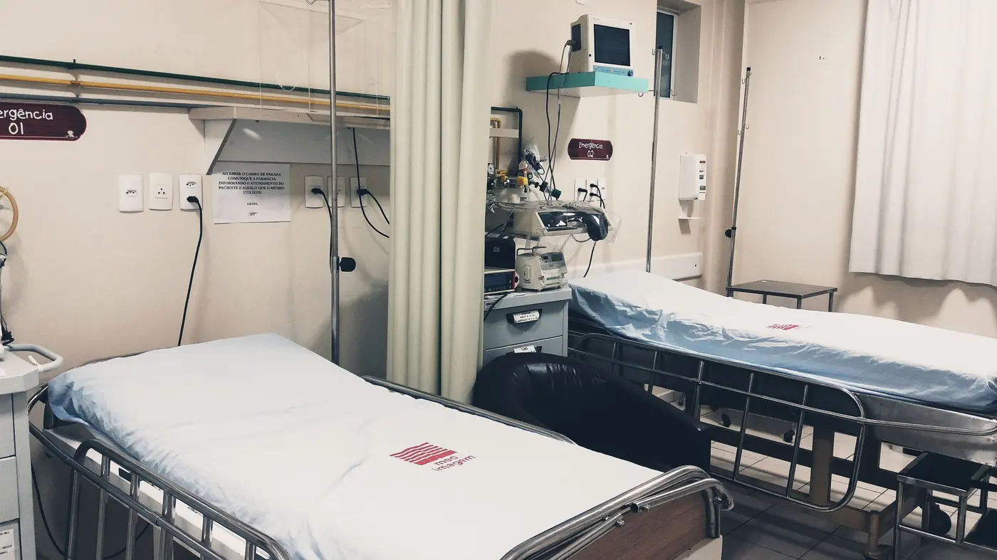 Stock photo: hospital room with empty beds and bedside equipment
