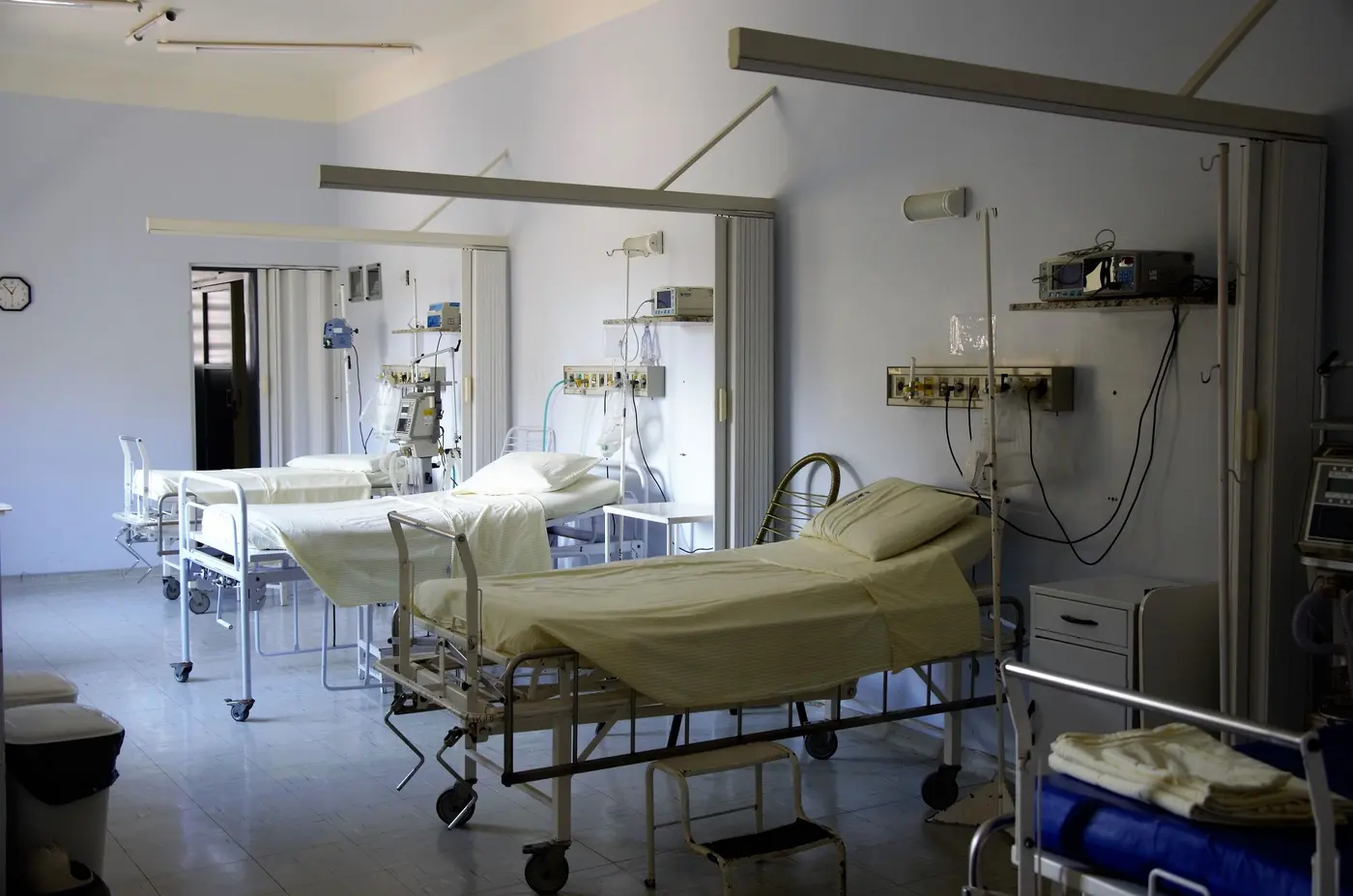 Stock photo: hospital ward with empty beds and wall mounted equipment