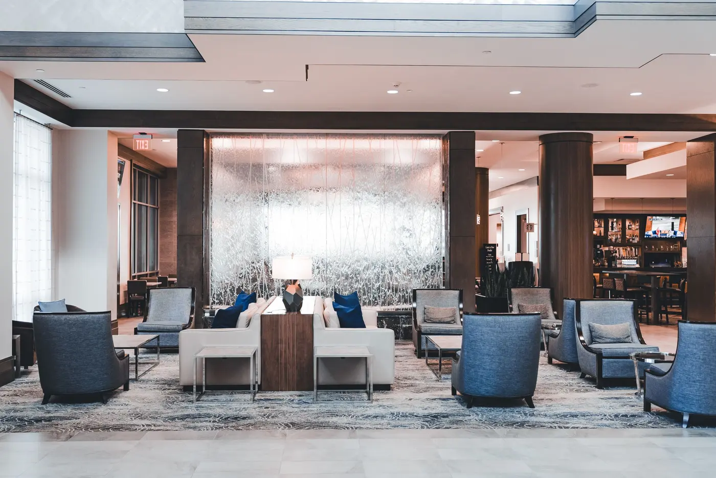 Stock photo: hotel lobby seating area with a bar and TV in the background