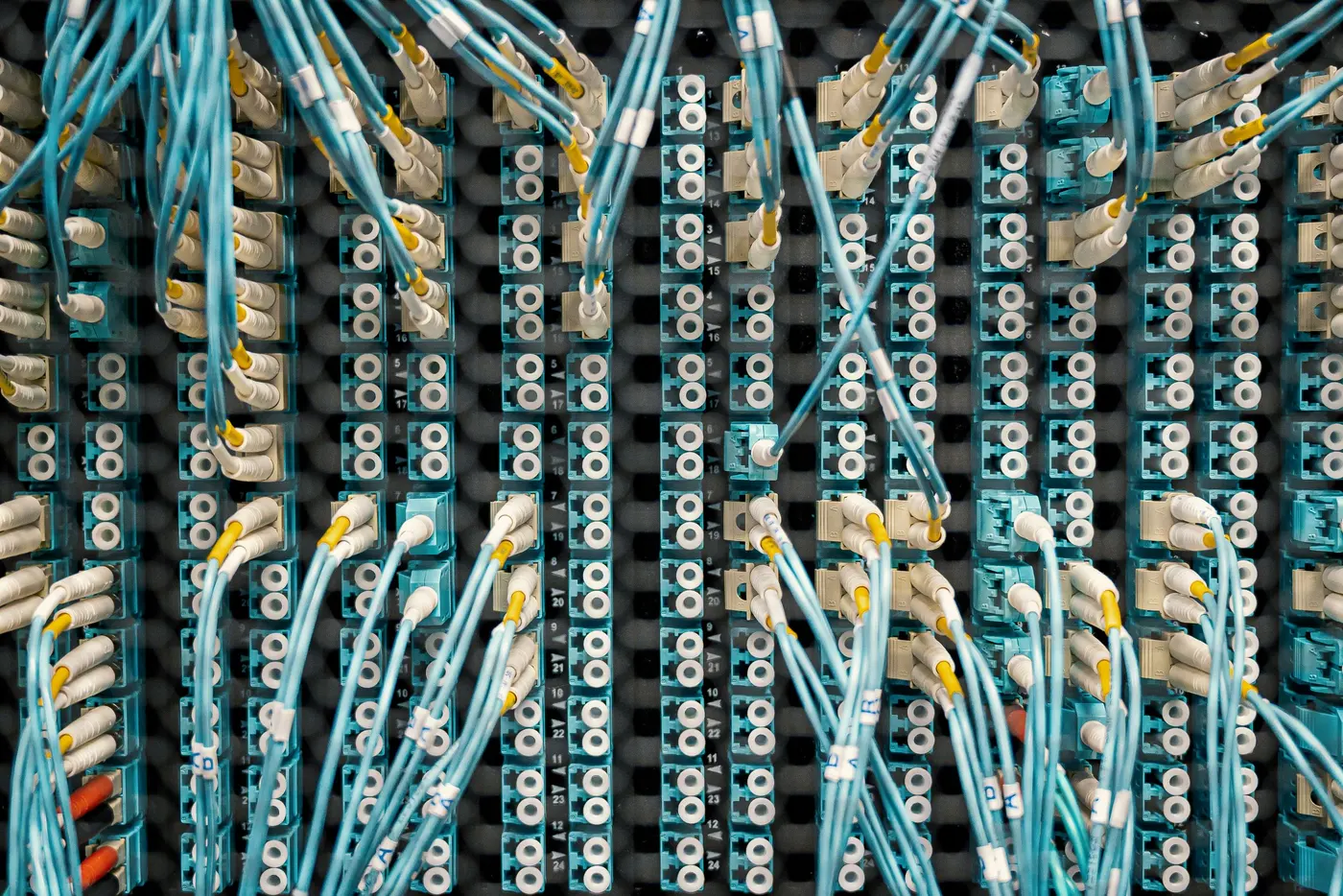 Stock photo: patch panel ports with rows of terminated network cables