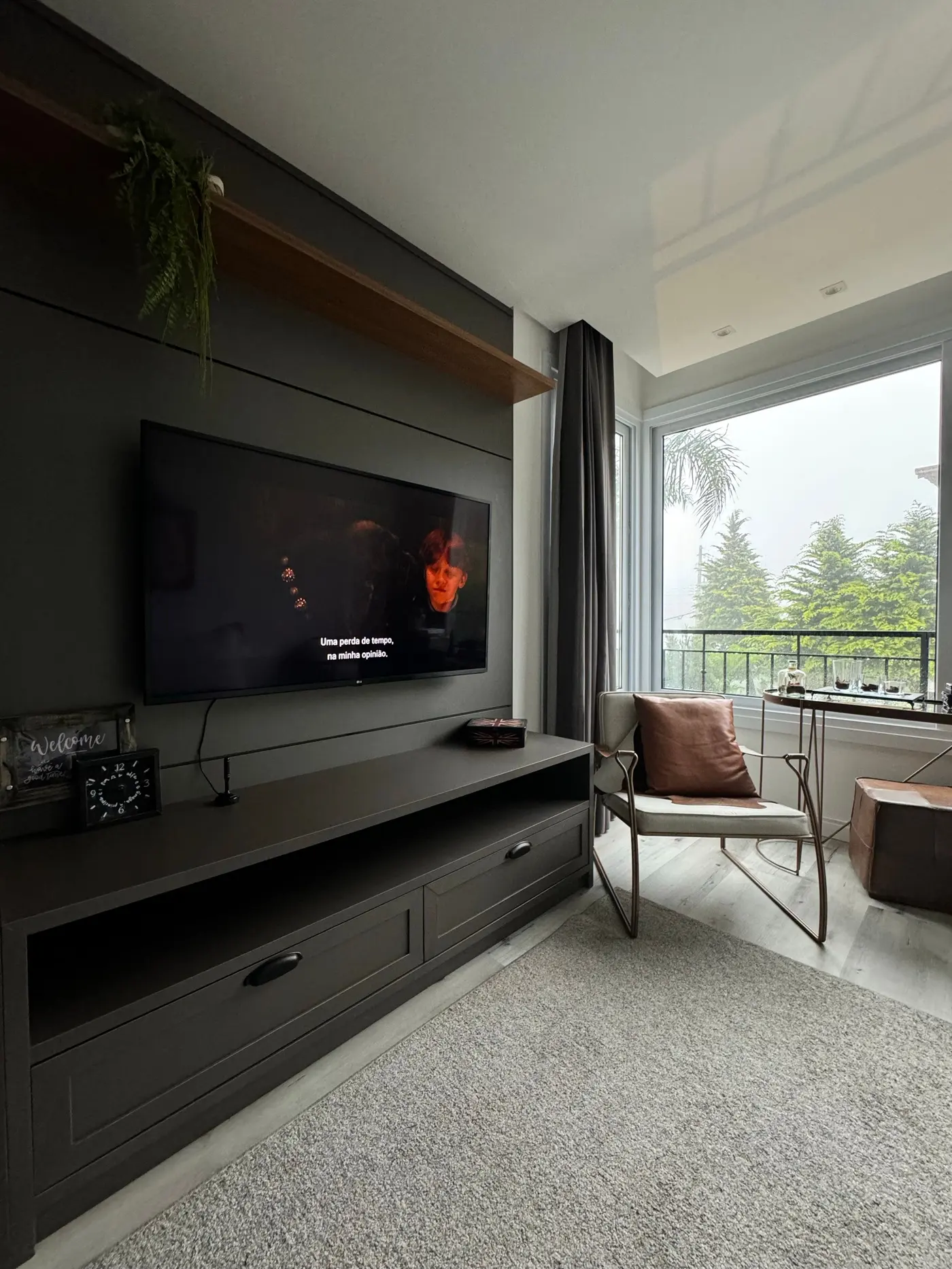 Stock photo: wall mounted TV in a lounge with a balcony view